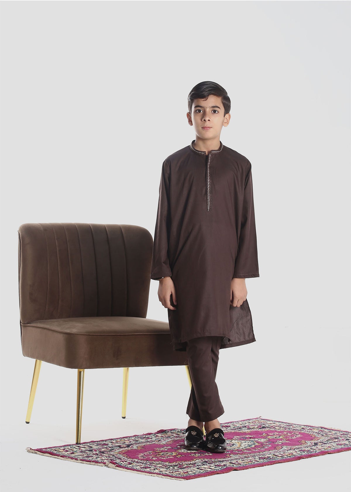 "Traditional boys' kurta pajama set featuring a long, straight-cut kurta with matching loose-fitting pajama trousers, ideal for cultural or festive occasions."